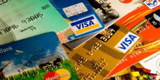 Close-up of credit cards AI-generated content may be incorrect.