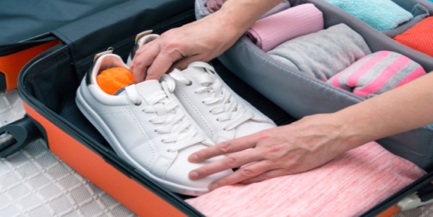 A person putting on a pair of shoes AI-generated content may be incorrect.